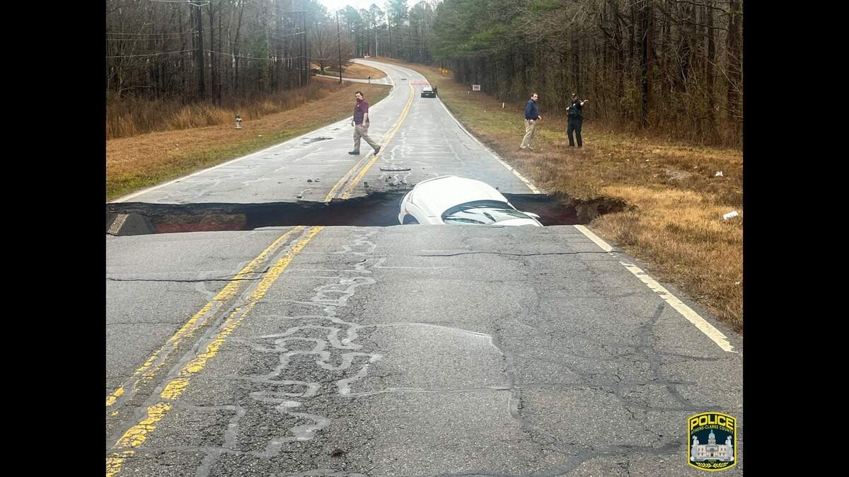 Sinkhole swallows car driving during Georgia storm: photos | Macon